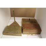 Three Persian boxes and a similar pen stand.