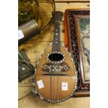 A mandolin with mother-of-pearl inlaid decoration.