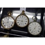 A silver pocket watch and two gilt metal pocket watches.