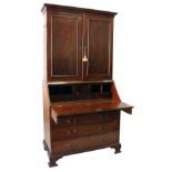 A good George III mahogany bureau / cupboard bookcase, with moulded cornice over a pair of