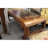 A Chinese hardwood low table with curving ends.