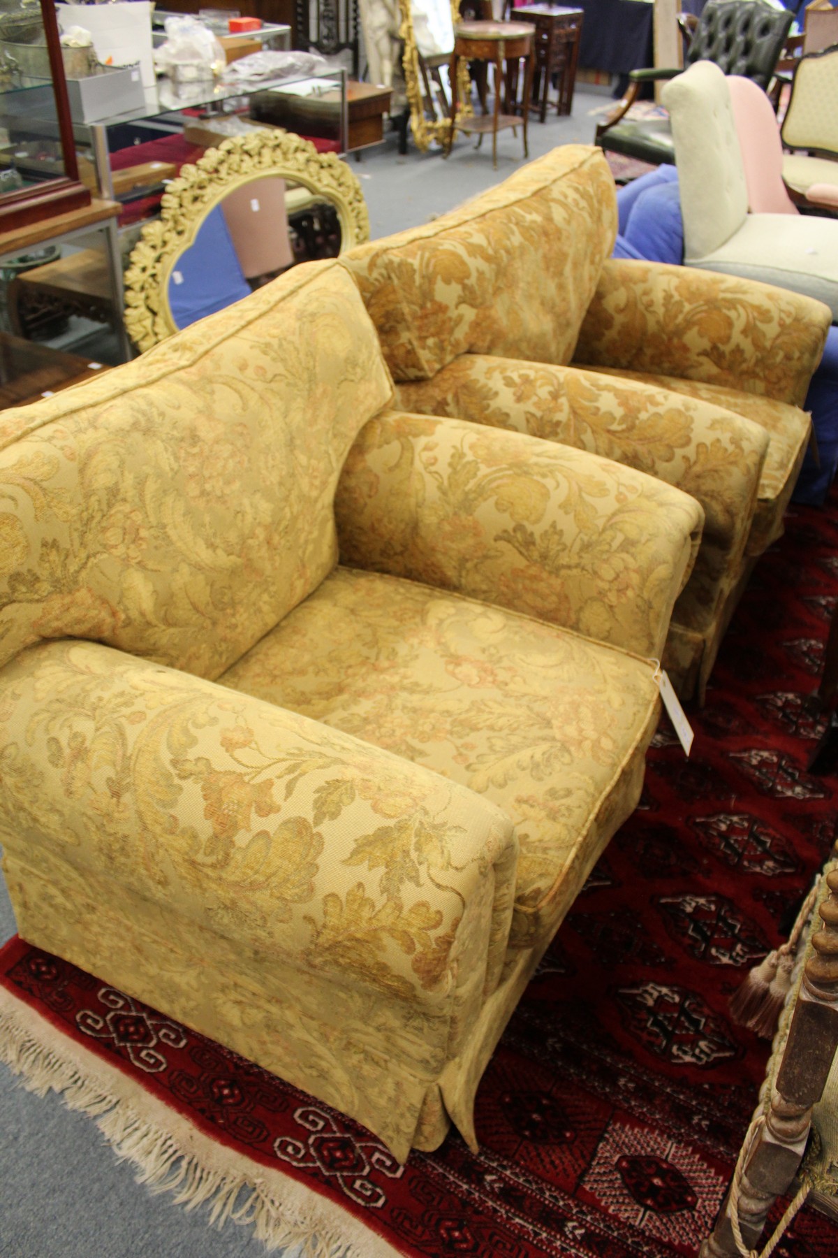 A pair of modern large upholstered armchairs.