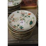 Ten small Chinese floral decorated saucers.