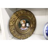 Continental porcelain and embossed circular portrait plaque.