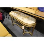 A gilt framed long stool or window seat.