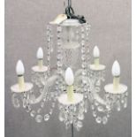 A Venetian style cut glass five branch chandelier.