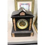 A Victorian slate mantle clock.