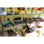 A good collection of O gauge railway locomotives, carriages and accessories together with a tin-