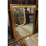 A pair of modern rectangular gilt framed wall mirrors.