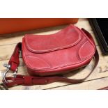 A Burberry red leather handbag.