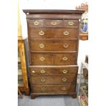 A George III mahogany tallboy with a dentile moulded cornice, three small drawers over six further