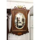 A George III design mahogany and inlaid fretwork wall mirror.