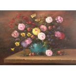 20th century continental school, A still life of mixed flowers in a blue vase, oil on card,