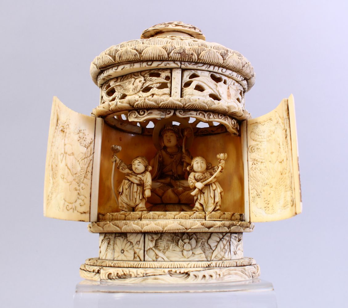 A GOOD QUALITY EARLIER 19TH CENTURY CARVED IVORY IMMORTAL SHRINE, carved in relief to depict