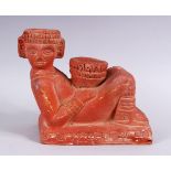 AN EGYPTIAN TERRACOTTA / TOPHANE POTTERY FIGURE OF A RECLINING MAN, 16cm high x 21cm