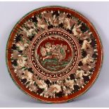 A 19TH CENTURY OR EARLIER INDIAN POTTERY DISH, with poly chrome decoration depicting a multi