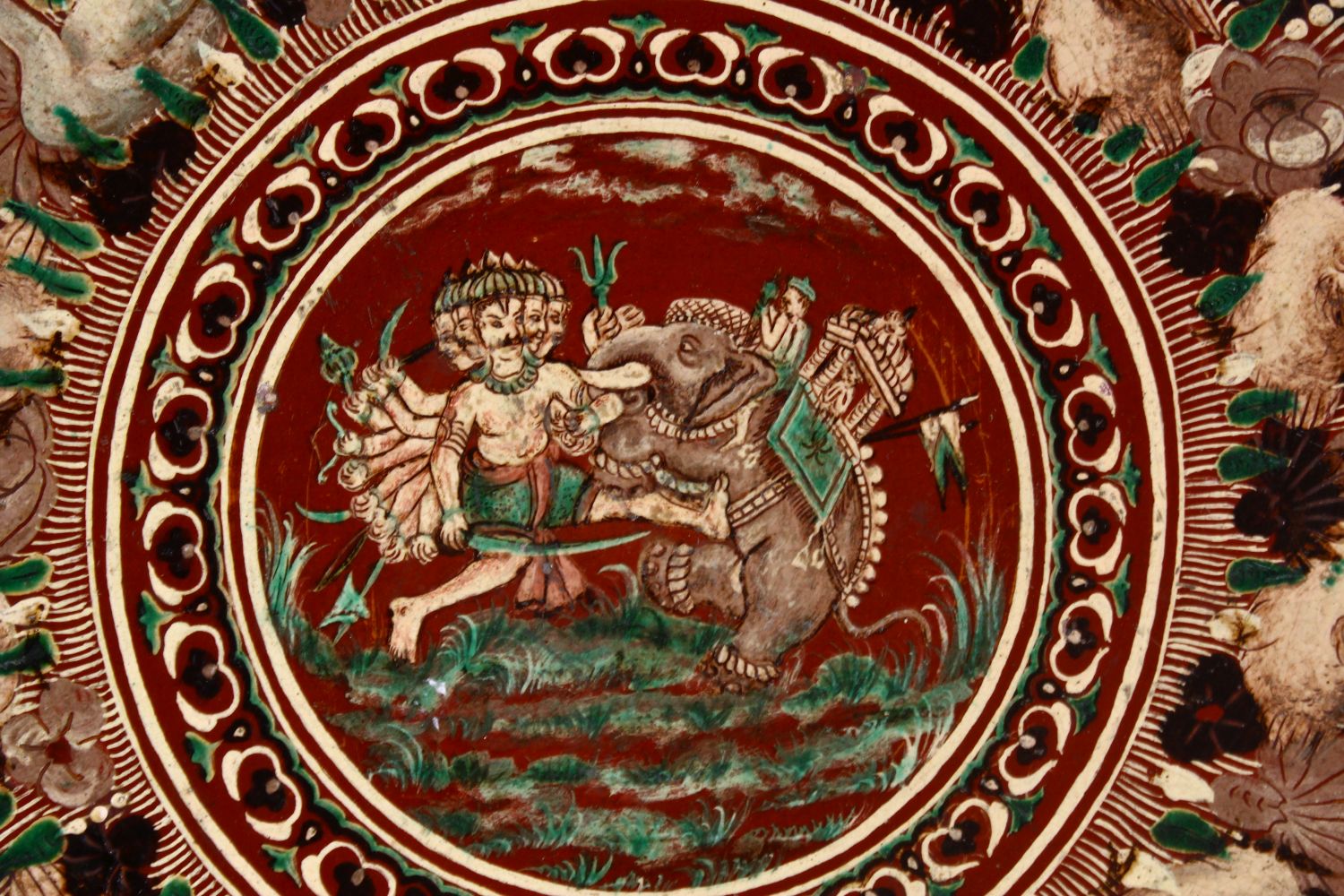 A 19TH CENTURY OR EARLIER INDIAN POTTERY DISH, with poly chrome decoration depicting a multi - Image 2 of 5