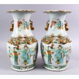 A FINE PAIR OF 19TH CENTURY CHINESE CANTON FAMILLE ROSE PORCELAIN VASES, the vases decorated with