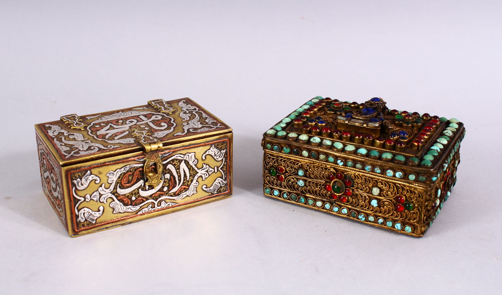 TWO GOOD ISLAMIC / INDIAN LIDDED MIXED METAL CALLIGRAPHIC BOXES, One with silver inlays of