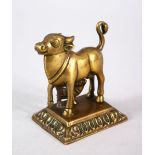A 18TH / 19TH CENTURY INDIAN BRONZE COW NANDI FIGURE, the cow stood with young 9cm high x 8.5cm