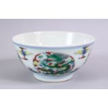 A CHINESE YONGZHENG STYLE DOUCAI DRAGON PORCELAIN RICE BOWL, decorated with roundel of dragons