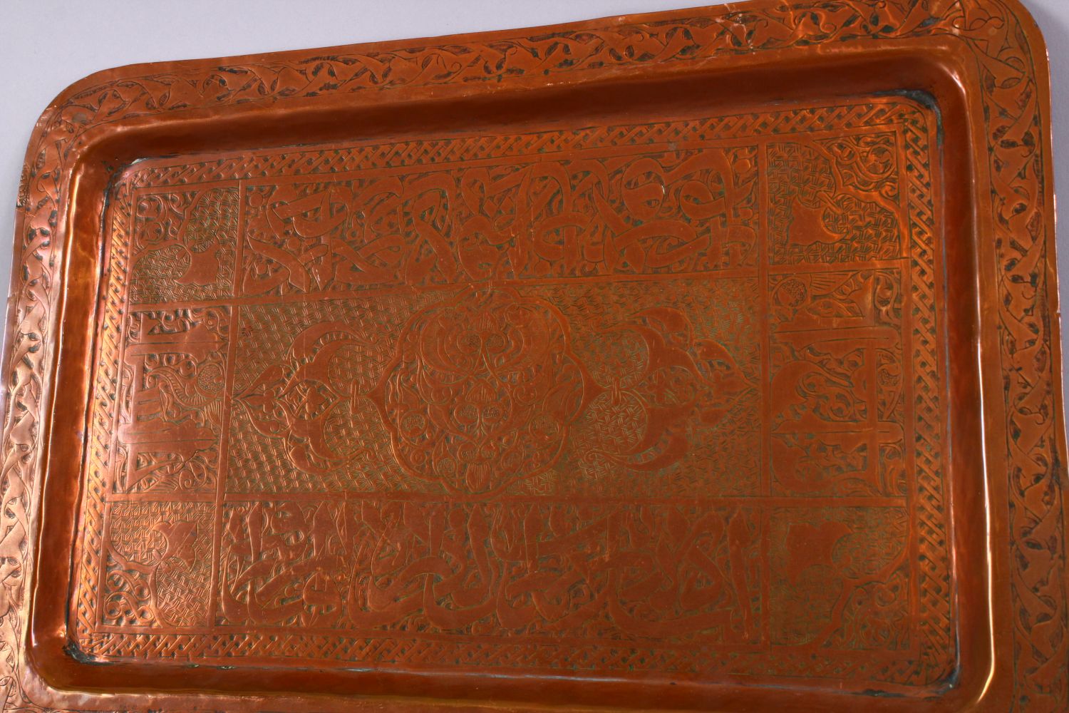 AN EARLY ISLAMIC CALLIGRAPHIC COPPER TRAY, the tray with formal floral motif and panels of - Image 2 of 3