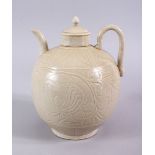 A GOOD CHINESE DING WARE POTTERY WINE EWER, the body with carved decoration 20cm x 17cm
