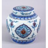 A GOOD CHINESE DOUCAI PORCELAIN GINGER JAR AND COVER, the body with panels of formal scrolling