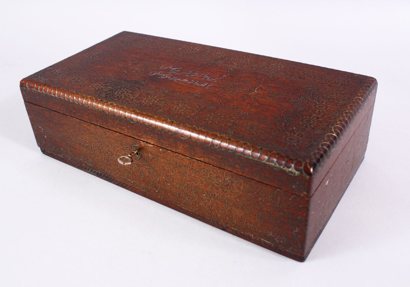 A FINE 19TH CENTURY INDO PERSIAN SILVER AND BRASS INLAID WOODEN BOX, with inlaid formal scroll