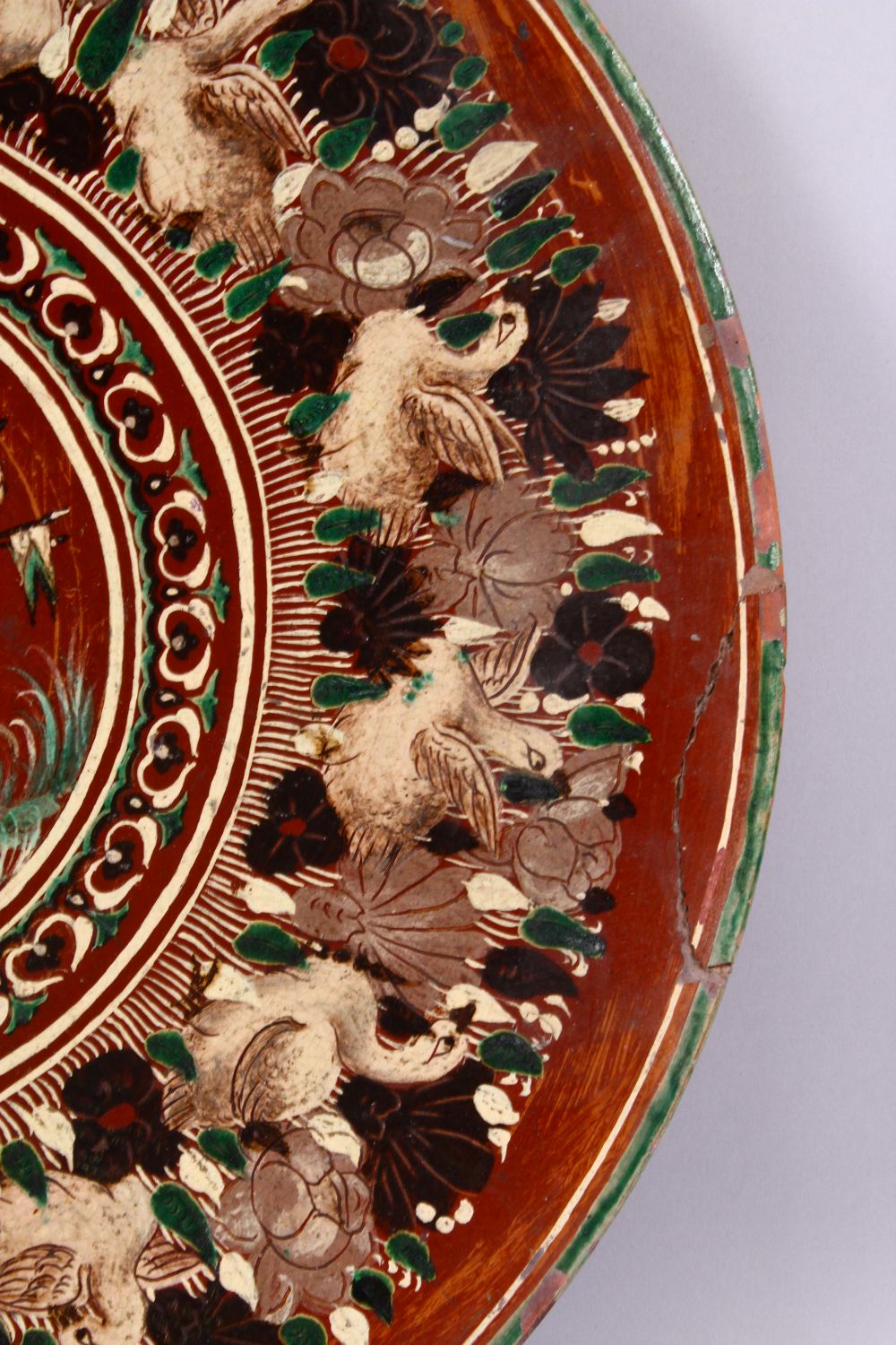 A 19TH CENTURY OR EARLIER INDIAN POTTERY DISH, with poly chrome decoration depicting a multi - Image 4 of 5