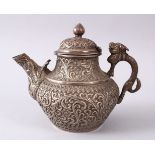 A GOOD 19TH CENTURY TURKISH SOLID SILVER TEAPOT carved with formal foliage and a dog style handle,