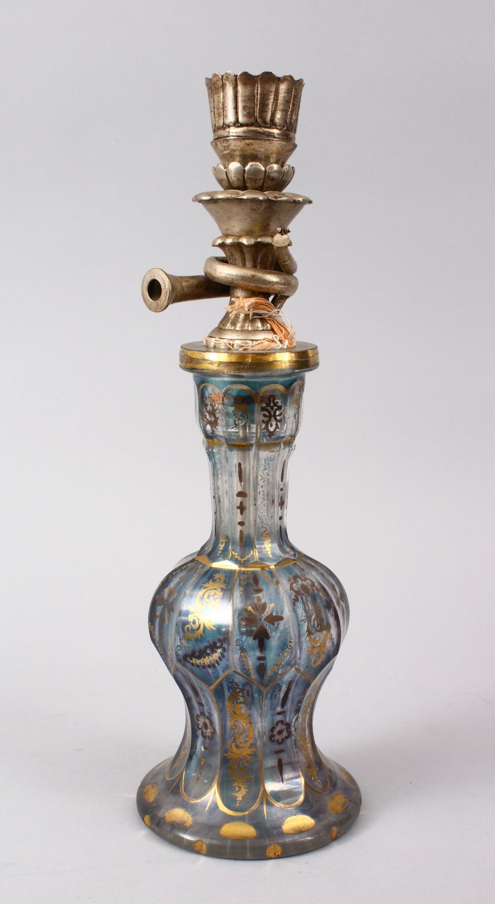 A 19TH CENTURY BOHEMIAN GILT GLASS HUQQA BASE WITH A WHITE METAL TOP, 38cm.