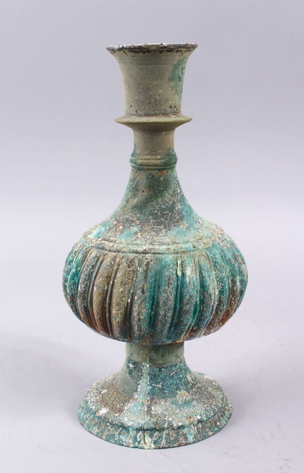 A GOOD EARLY ISLAMIC BRONZE HUQQA BASE, with facet body and verdigris27cm.,