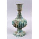 A GOOD EARLY ISLAMIC BRONZE HUQQA BASE, with facet body and verdigris27cm.,