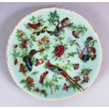 A 19TH CENTURY CHINESE CELADON FAMMILE ROSE PORCELAIN PLATE, decorated with peacocks and butterflies