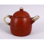 A CHINESE YIXING CLAY TEAPOT MOUNTED WITH A JADE HANDLE, SPOUT AND FINIAL, the base with an