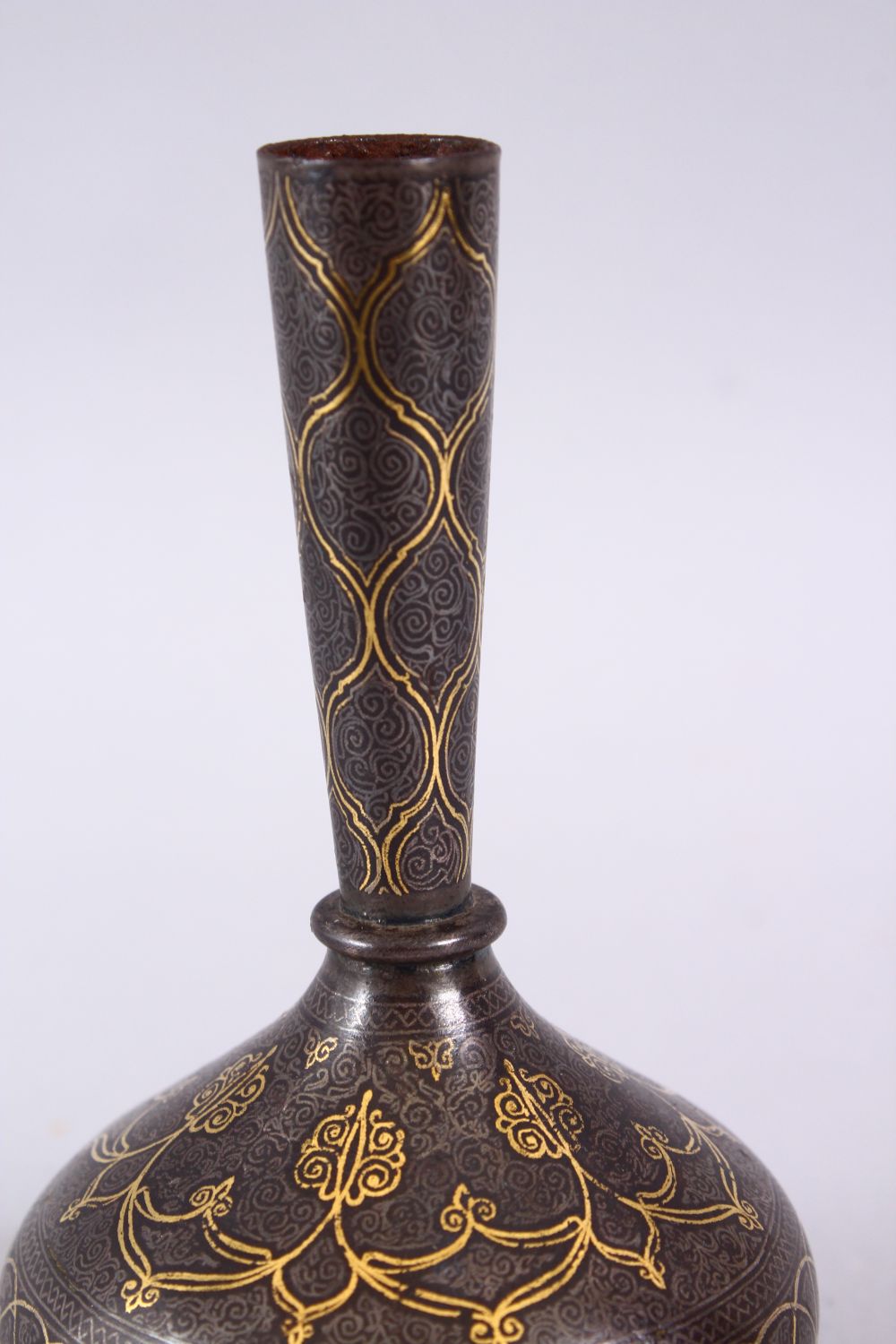 AN 18TH / 19TH CENTURY ISLAMIC GOLD INLAID STEEL VASE, the gold inlay with formal decoration, 13cm. - Image 2 of 4