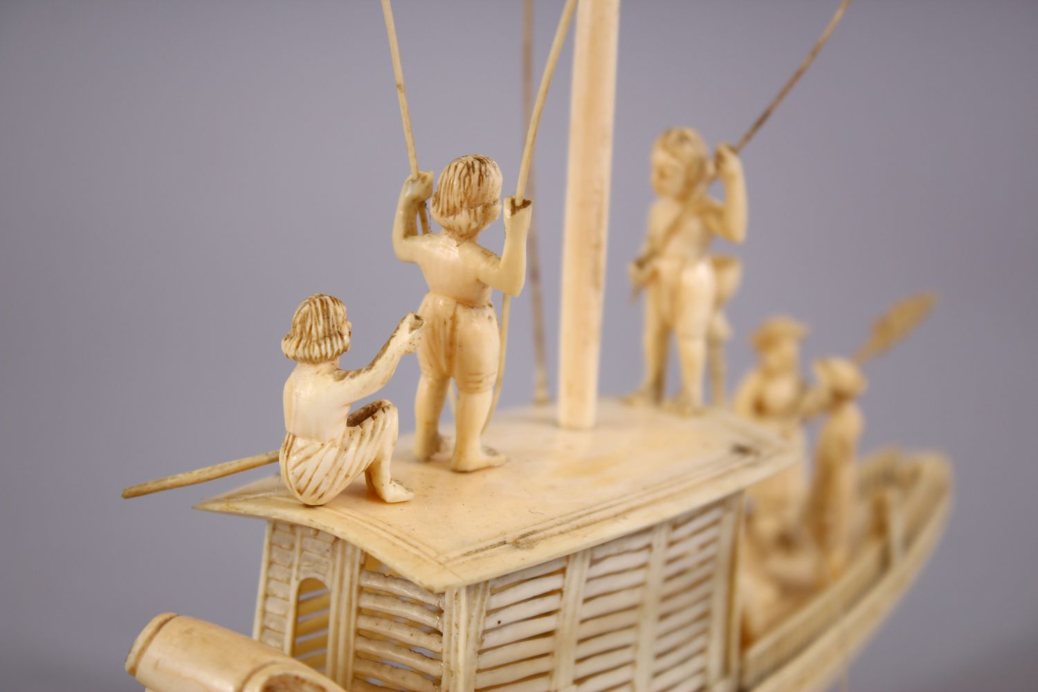 A FINELY CARVED 19TH CENTURY INDIAN IVORY BOAT WITH FISHERMEN, with fine strands of sails, six - Image 5 of 11