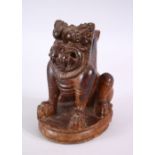 A 17TH CENTURY OR EARLIER SOUTH INDIAN CARVED WOODEN YALI FIGURE, 17cm high x 13cm wide.