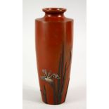 A JAPANESE MEIJI PERIOD BRONZE & MIXED METAL VASE, the red ground with a display of simple iris,