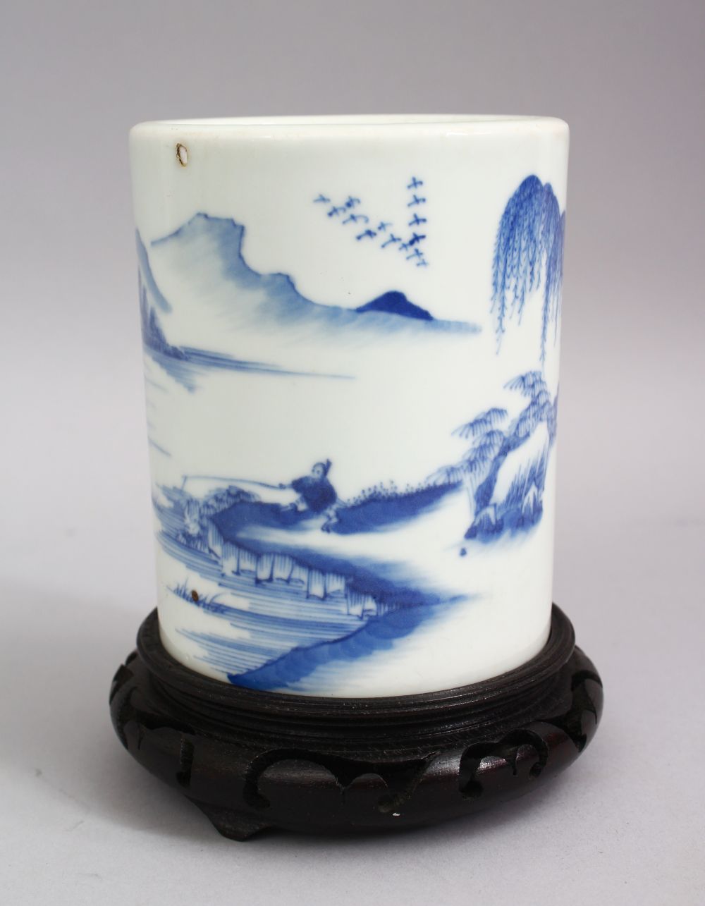 A CHINESE BLUE & WHITE PORCELAIN BRUSH WASHER & HARDWOOD STAND, The body of the pot decorated with