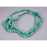 A CHINESE CARVED APPLE GREEN JADE LIKE NECKLACE, 118CM APPROX OPEN.
