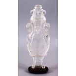 AN 18TH CENTURY CHINESE CARVED ROCK CRYSTAL VASE AND COVER, with rams head and ring handles, with