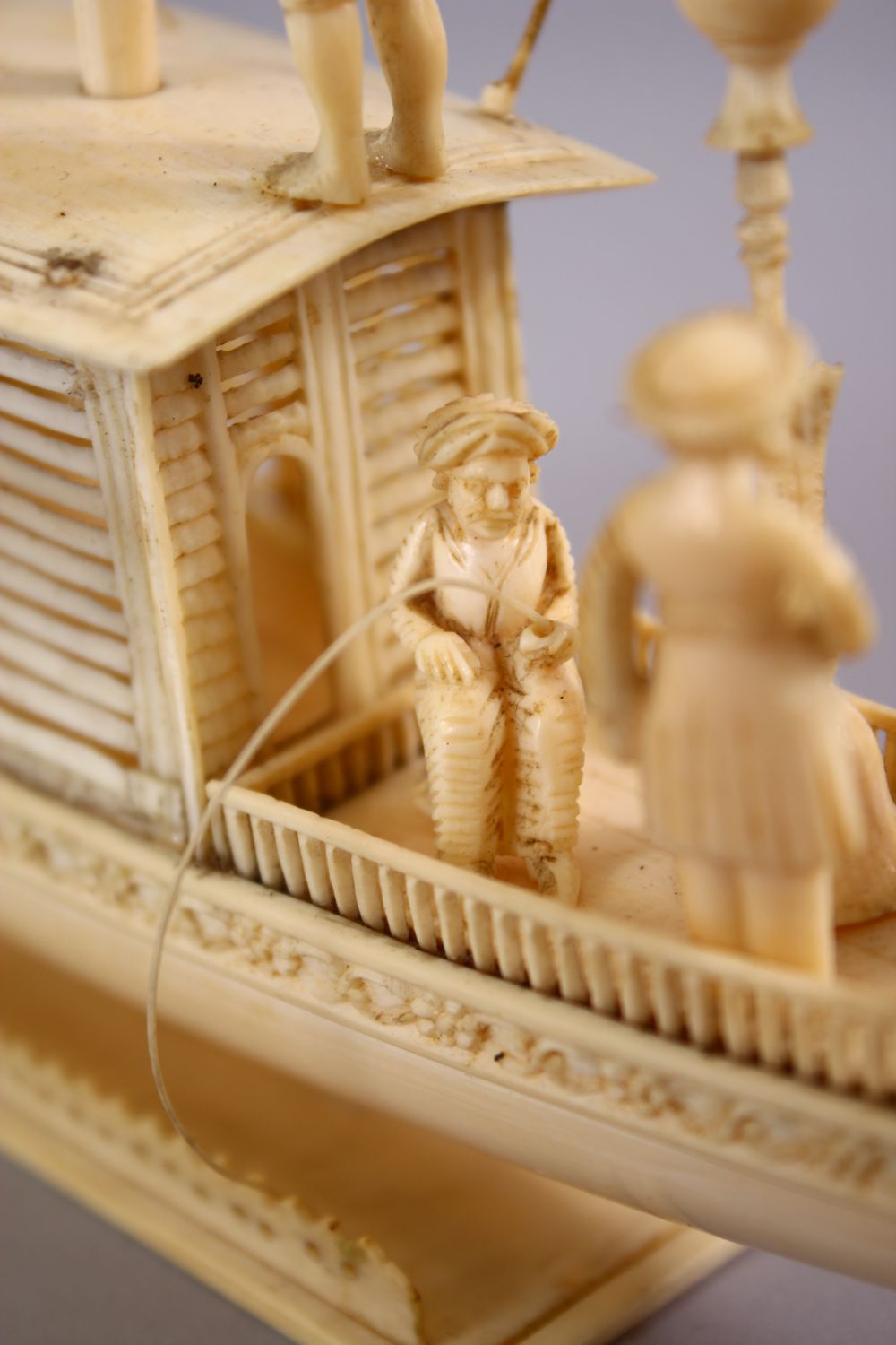 A FINELY CARVED 19TH CENTURY INDIAN IVORY BOAT WITH FISHERMEN, with fine strands of sails, six - Image 9 of 11