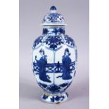 A CHINESE KANGXI PERIOD BLUE & WHITE PORCELAIN JAR AND COVER, with panels of figures and flora,