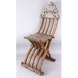 A 19TH CENTURY OR EARLIER ISLAMIC WOOD AND MOTHER OF PEARL FOLDING CHAIR, with inlaid wire and