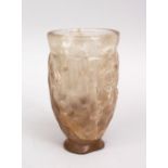 AN UNUSUAL CARVED ROCK CRYSTAL BEAKER, possibly early Persian, 11.5cm.