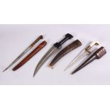 A COLLECTION OF 3 ISLAMIC DAGGERS - One with a bone handle and leather sheath 35cm, one with a