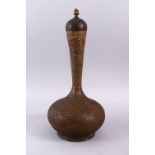 A LARGE 19TH CENTURY INDIAN COPPER LIDDED BOTTLE, with carved formal foliage scroll, 39cm high