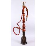 A 19TH CENTURY ISLAMIC HUQQA BASE & PIPE, the base with mixed alloy decoration, 79cm high.